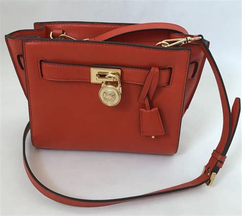 michael kors orange bowling bag|Michael Kors orange crossbody bag.